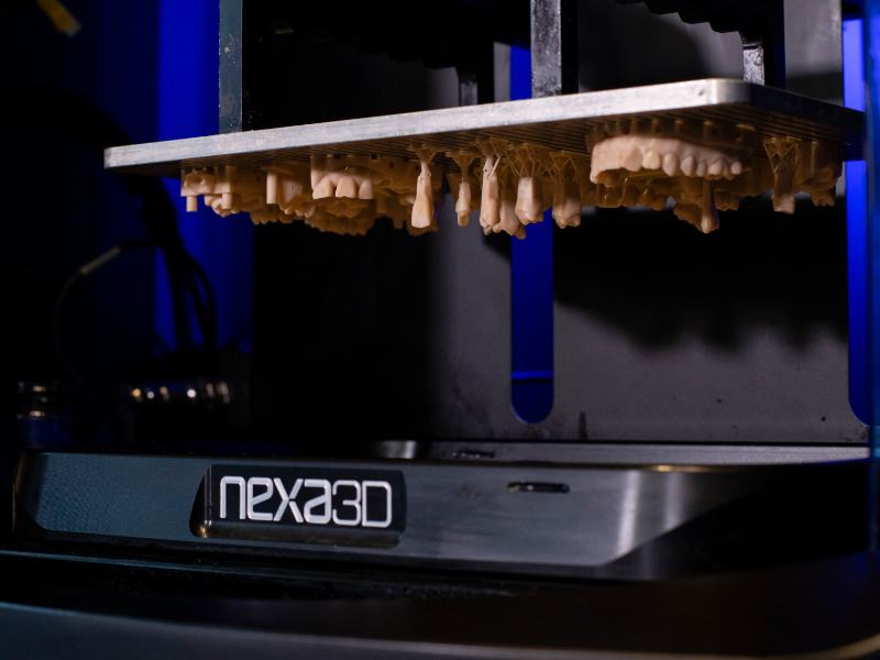 Close up of NXE 400 3D Printer with Teeth Molds being Printed